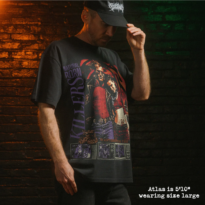 Model wearing heavy tee with natural born killers graphic 