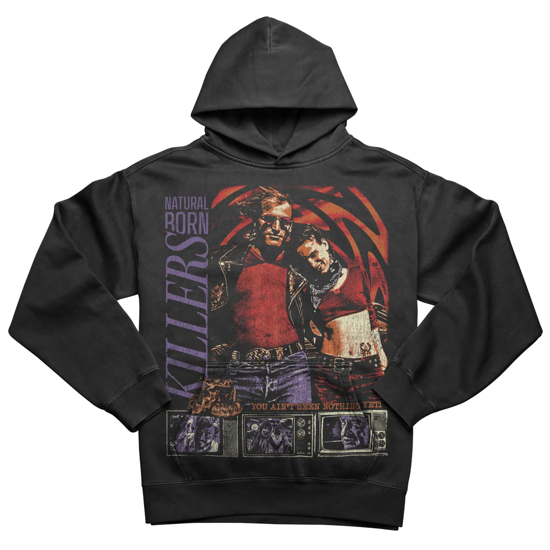 Black hoodie with a colorful graphic print of two figures and ’NATURAL BORN KILLERS’ text.