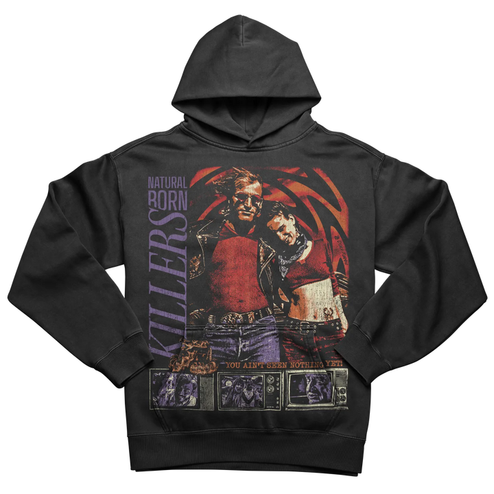 Black hoodie with a colorful graphic print of two figures and ’NATURAL BORN KILLERS’ text.
