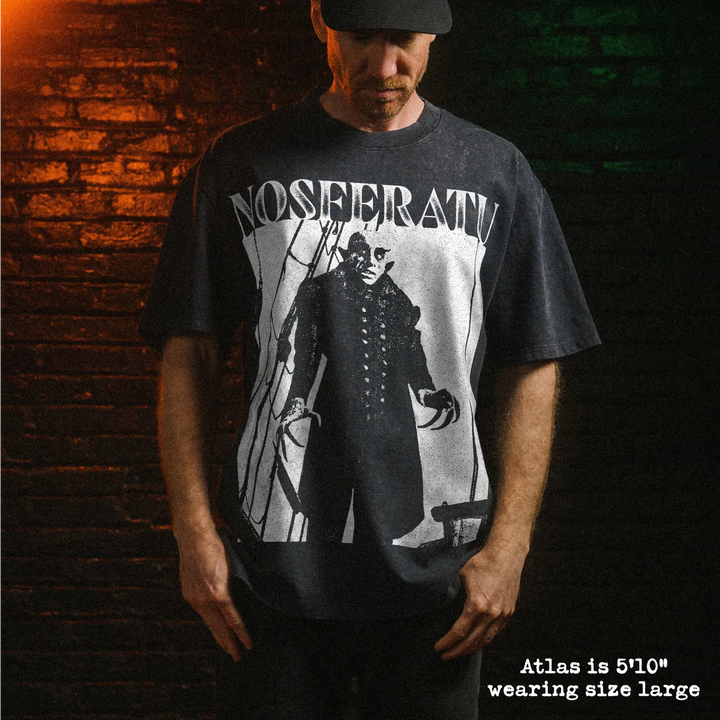 Male model wearing heavy stone washed tee with nosferatu graphic. 