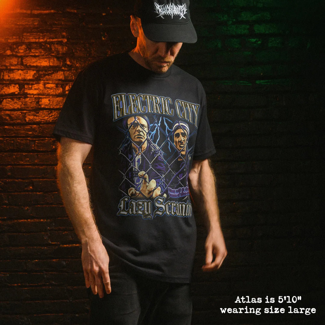 Male model wearing black premium tee with electric city graphic 