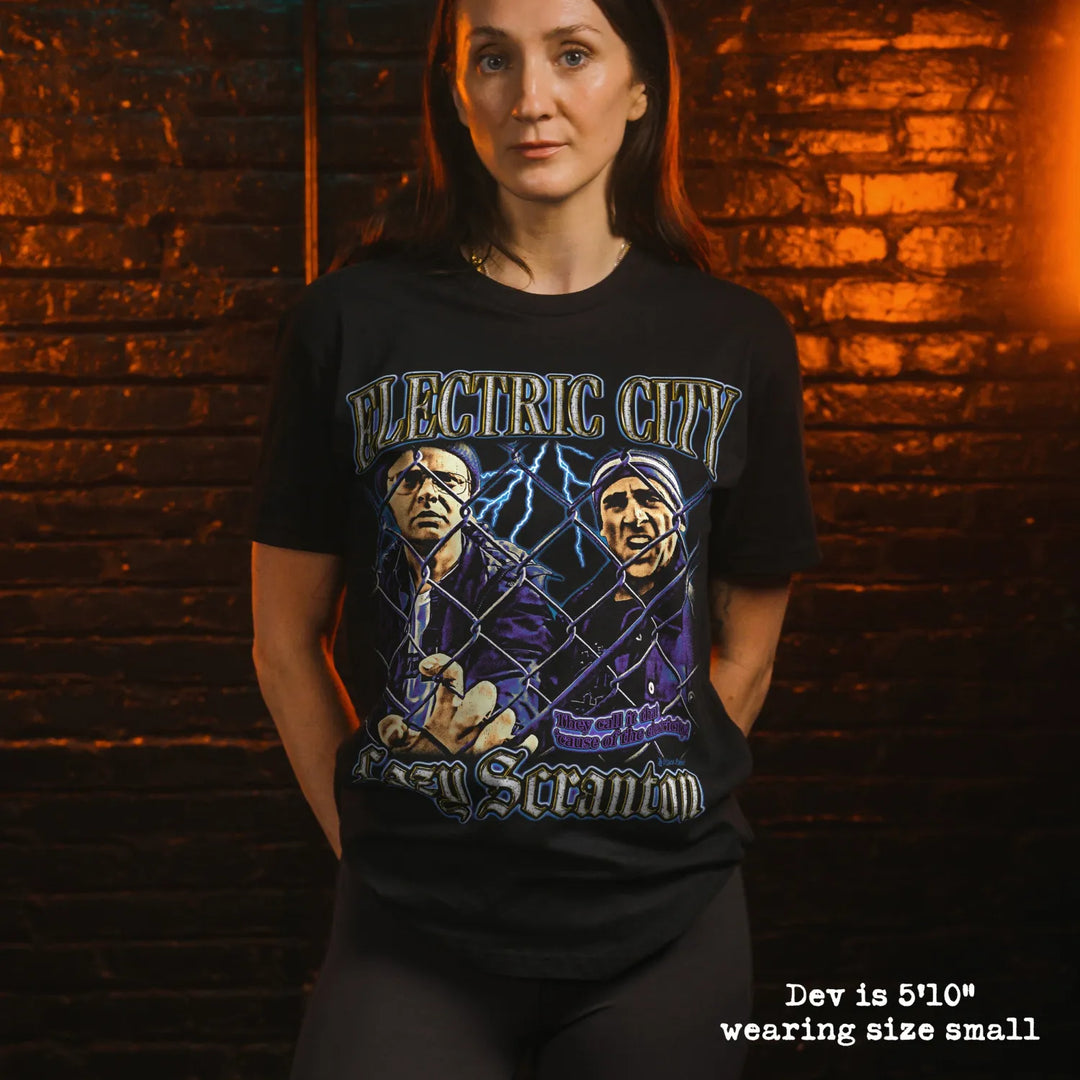 model wearing black premium tee with electric city graphic 