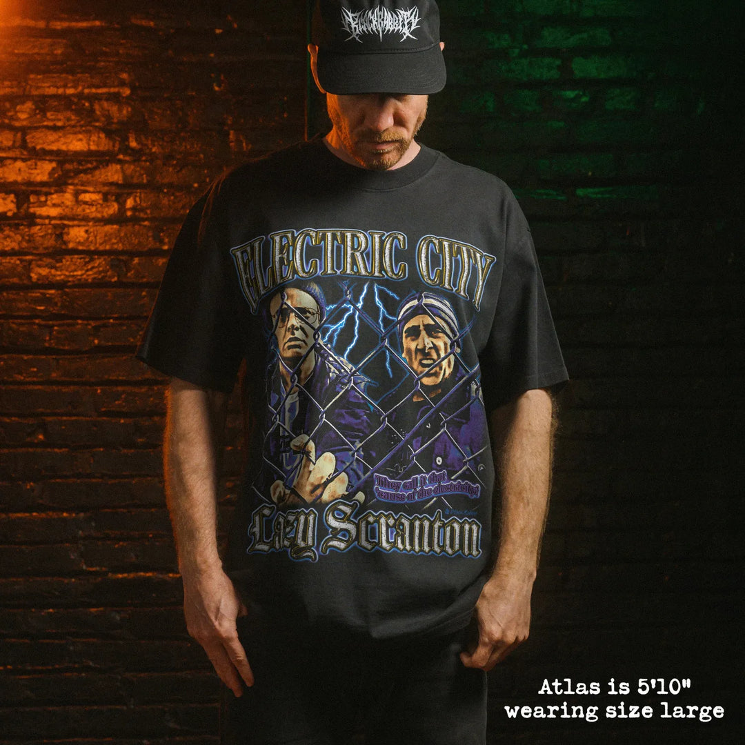 Model wearing heavy tee with electric city graphic 