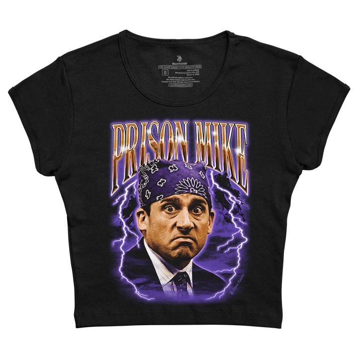 Black short-sleeved t-shirt featuring a vibrant graphic of prison mike from the office, surrounded by purple lightning bolts and bold gold lettering.