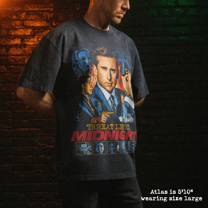 Male model wearing stone wash heavy tee with threat level graphic 