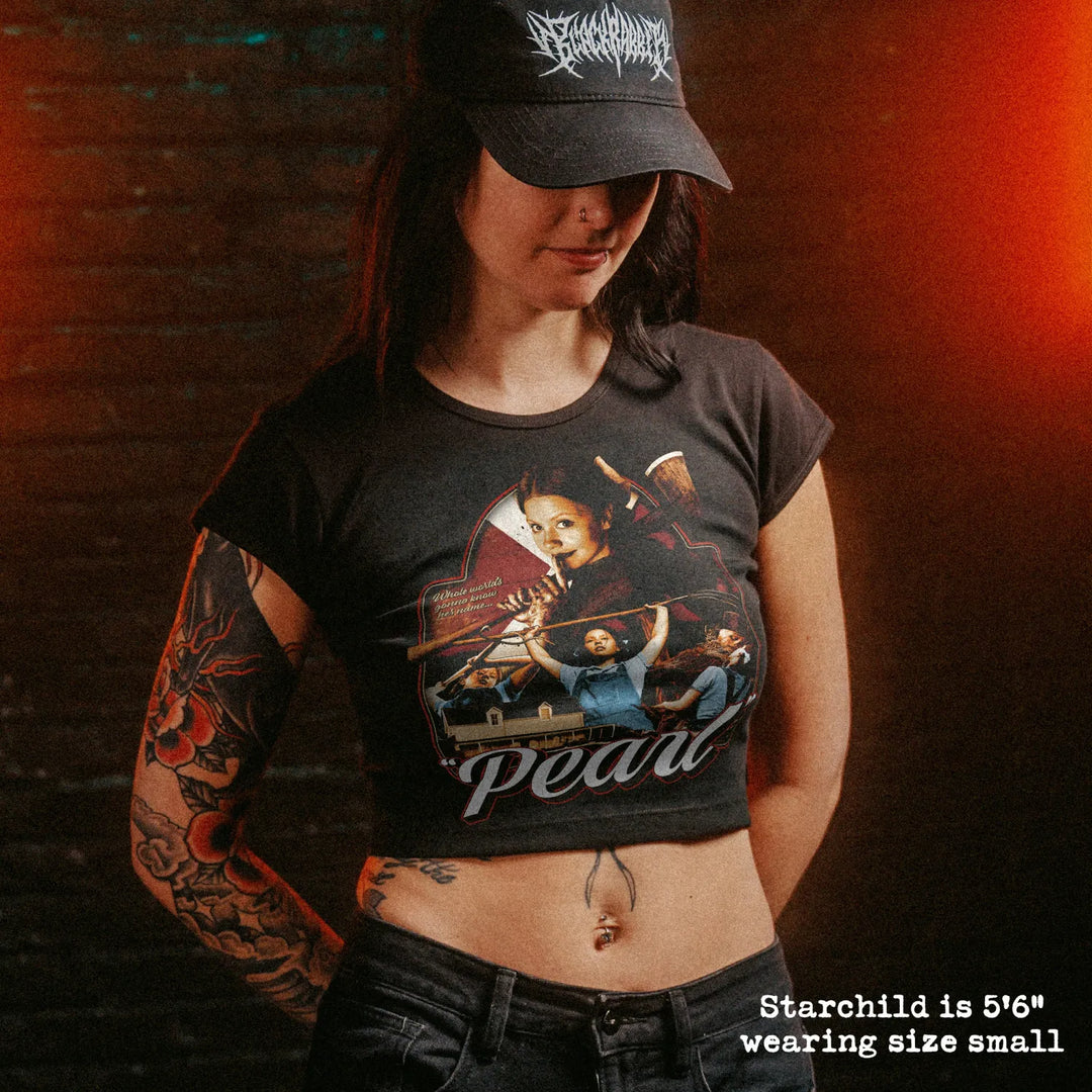 Female model wearing cropped baby tee with pearl graphic

