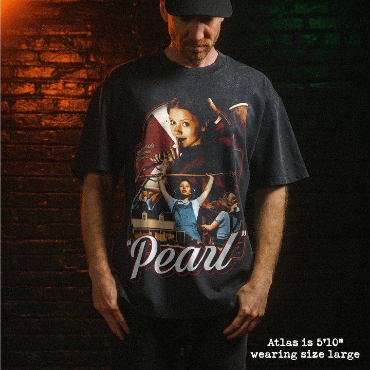Male model wearing heavy stone washed tee with pearl graphic. 