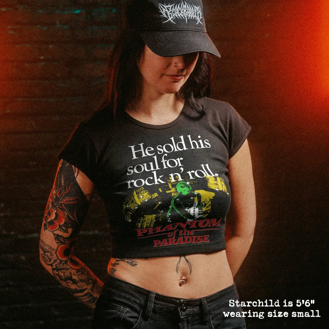 Female model wearing cropped baby tee with phantom of the paradise graphic
