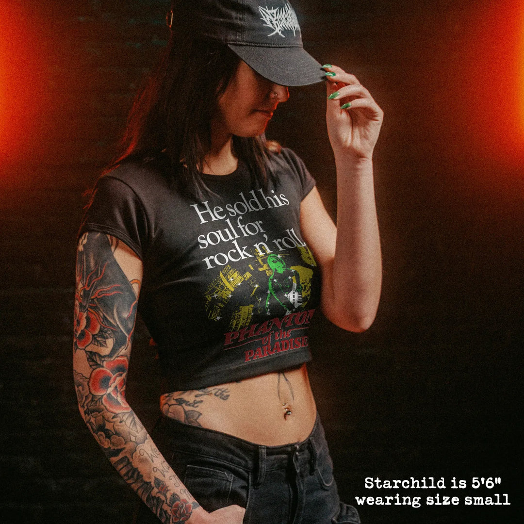 Female model wearing cropped baby tee with phantom of the paradise graphic
