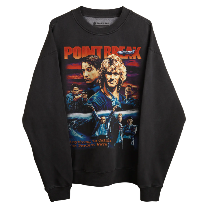 Black crewneck sweatshirt with ’point break’ graphic design featuring characters and title in bold, vibrant colors.
