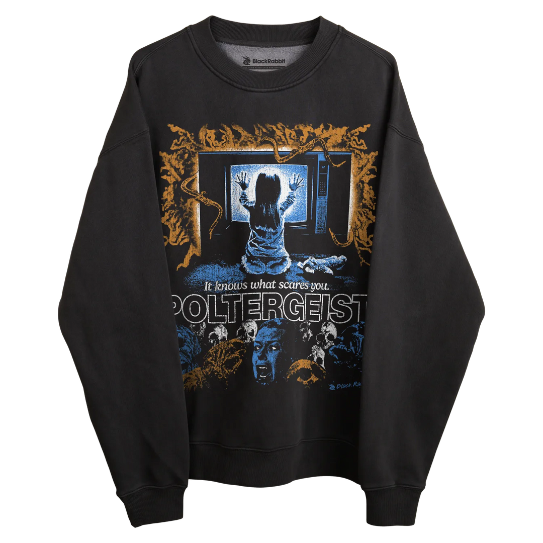 Poltergeist sweatshirt with ghostly design and text, black material.