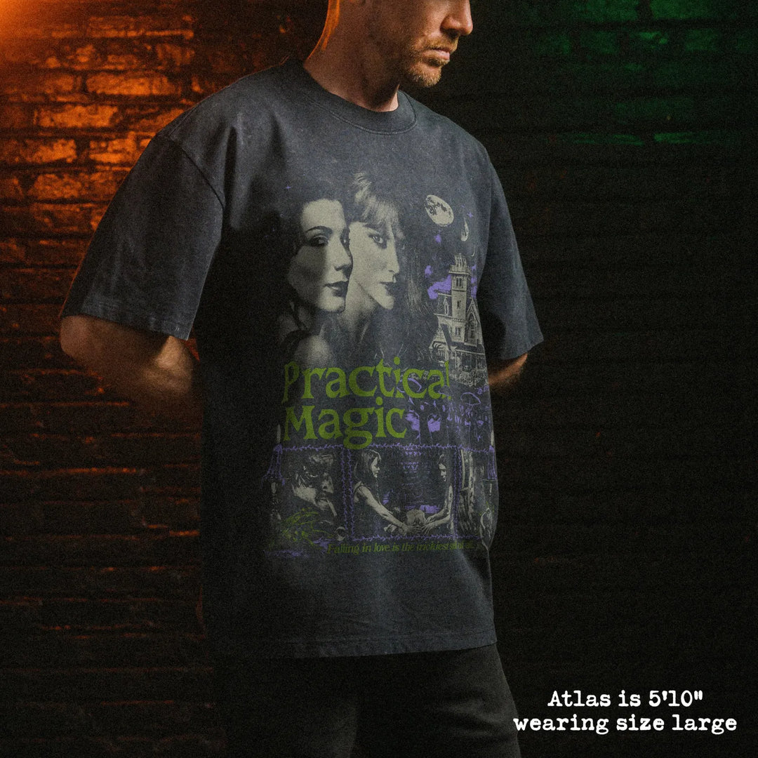 Male model wearing stone wash heavy tee with practical magic graphic 
