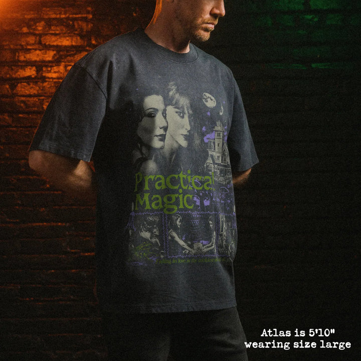 Male model wearing stone wash heavy tee with practical magic graphic 