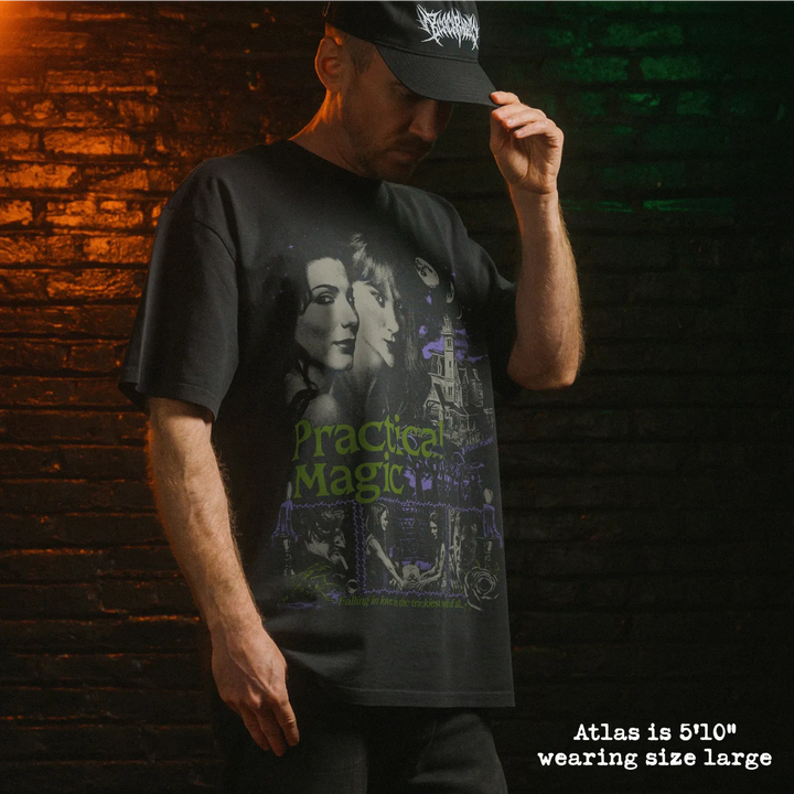 Model wearing heavy tee with practical magic graphic 