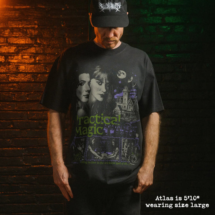 Model wearing heavy tee with practical magic graphic 
