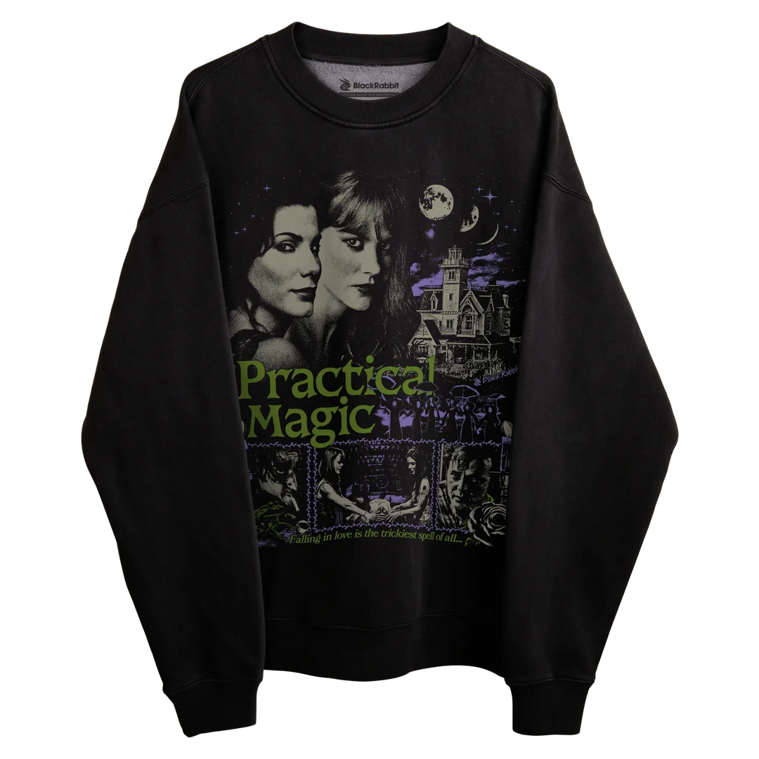 Black sweatshirt with practical magic graphic design featuring two sisters and a haunted house.