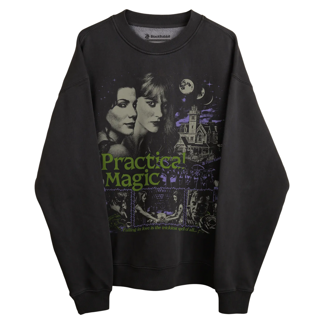 Black sweatshirt with practical magic design featuring two sisters and a haunted house, green text.