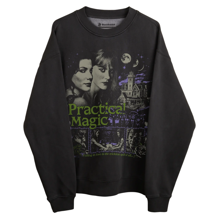 Black sweatshirt with practical magic design featuring two sisters and a haunted house, green text.