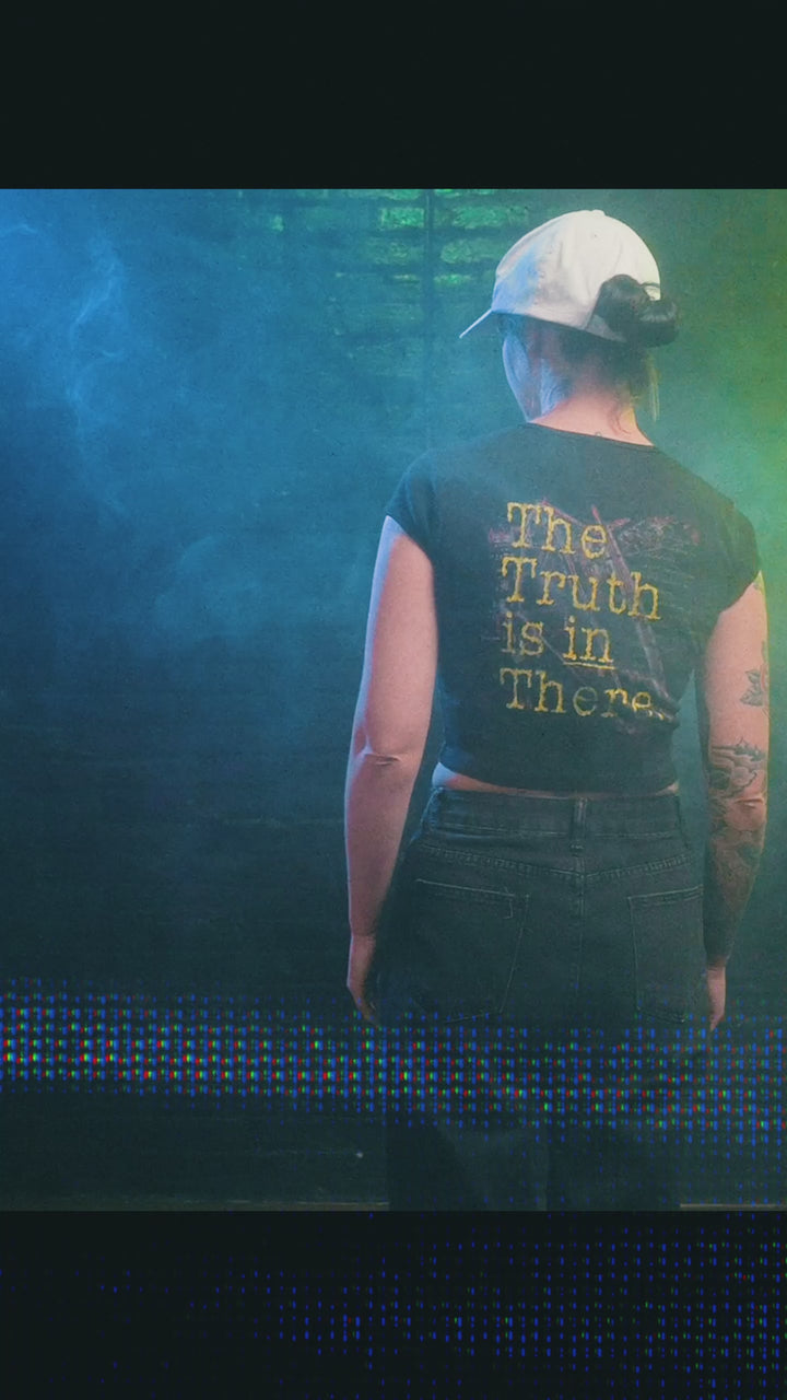 Female model wearing cropped baby tee showing variety of designs
