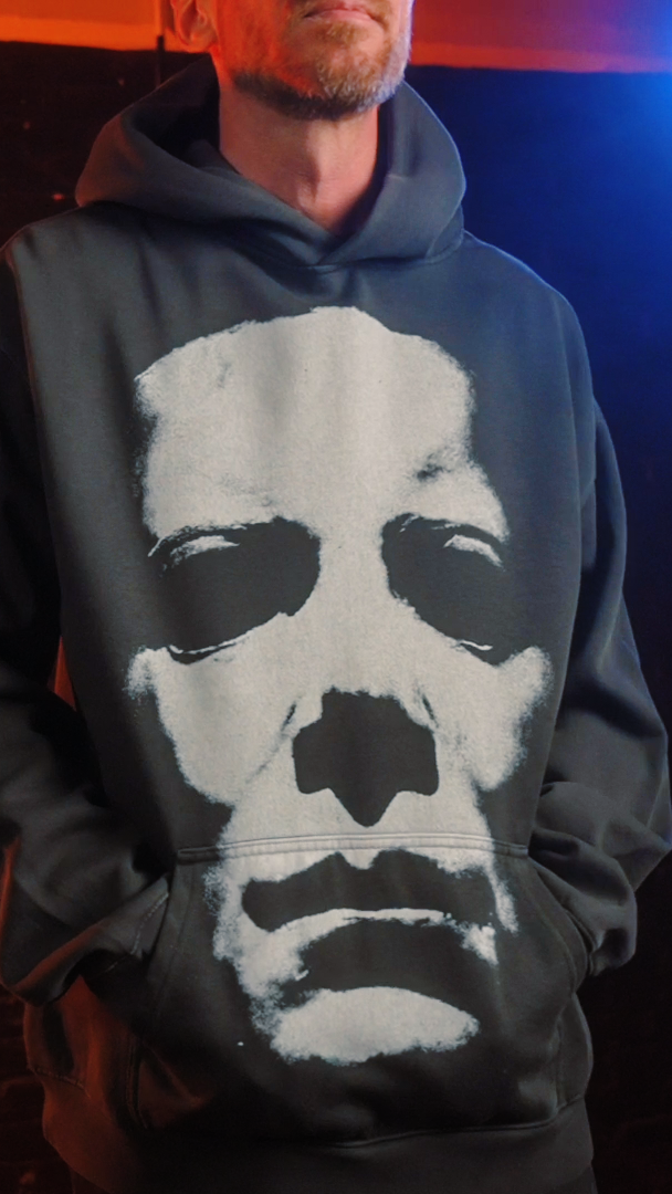 Black michael myers hoodie with white face design, inspired by the halloween franchise. 