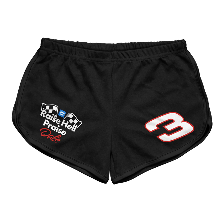 Black athletic shorts featuring a white and red ’3’’ on the right leg, with a logo reading “raise hell praise dale” in white text accented by checkered flags.