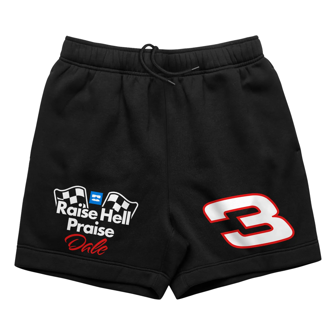 Black shorts with racing-themed graphics.