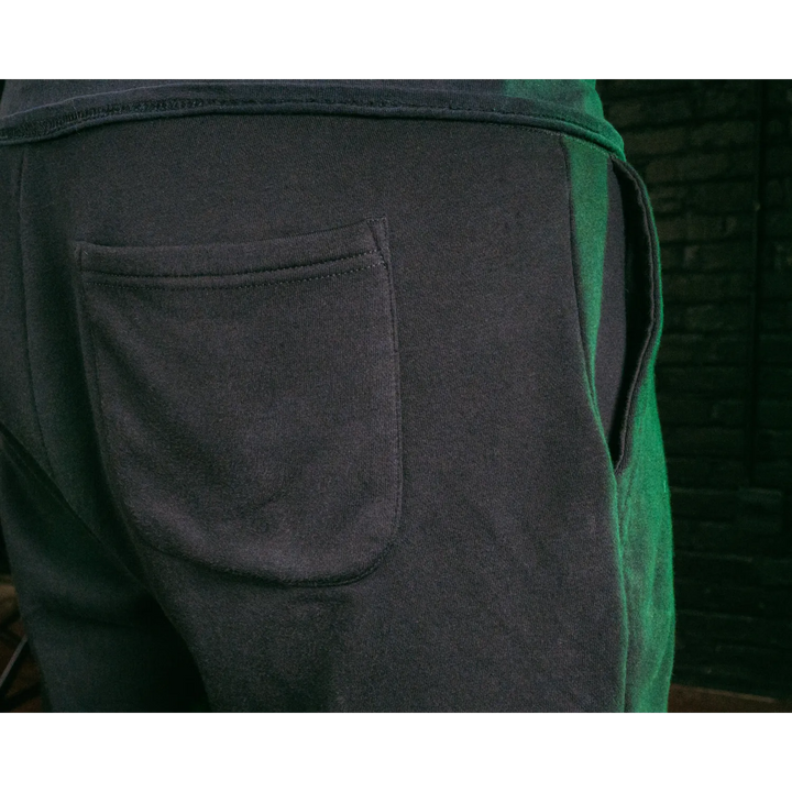 Dark sweatpants with pockets.
