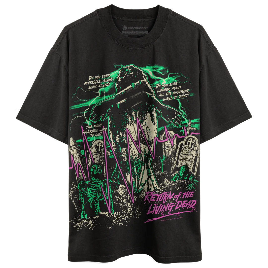 A black short-sleeve graphic t-shirt featuring a horror-themed design with a zombie, tombstones, green lightning, and purple text reading 'Return of the Living Dead'