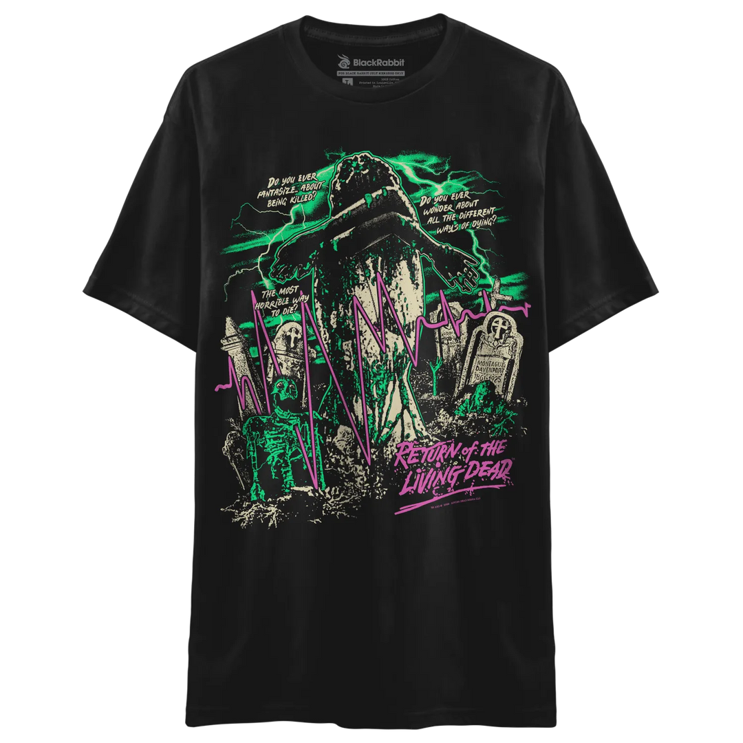 A black short-sleeve graphic t-shirt featuring a horror-themed graveyard illustration with green and pink neon accents and the text 'Return of the Living Dead'.