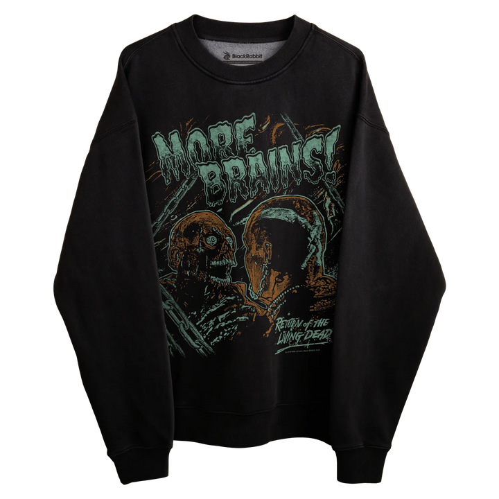 Black crewneck sweatshirt with graphic design of zombie heads and the text ’more brains’ in green, orange, white, and blue.