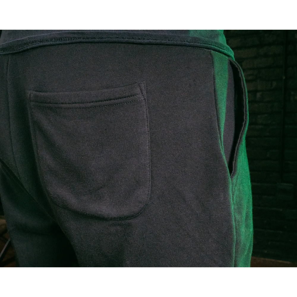 Dark sweatpants with pockets.