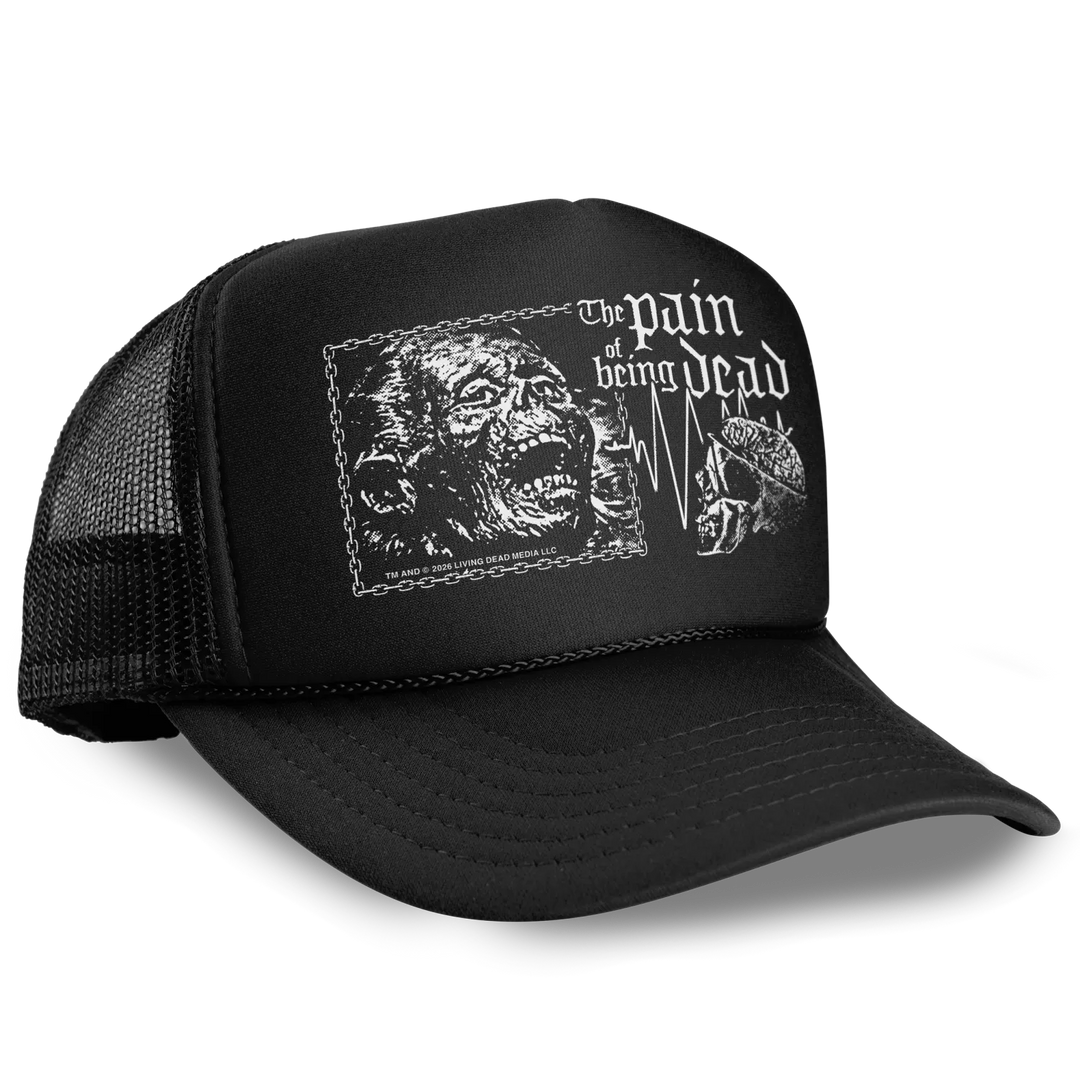 Black foam-front trucker hat featuring a white zombie face and ekg line with living dead text officially licensed