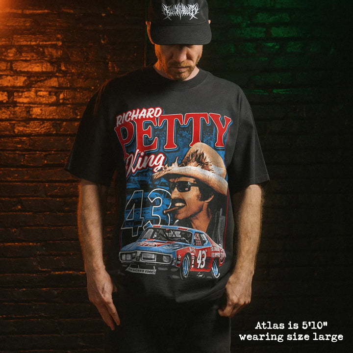 Model wearing heavy tee with petty graphic 