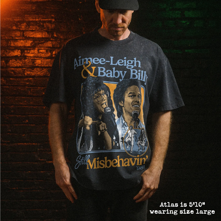 Male model wearing heavy stone washed tee with misbehavin graphic. 