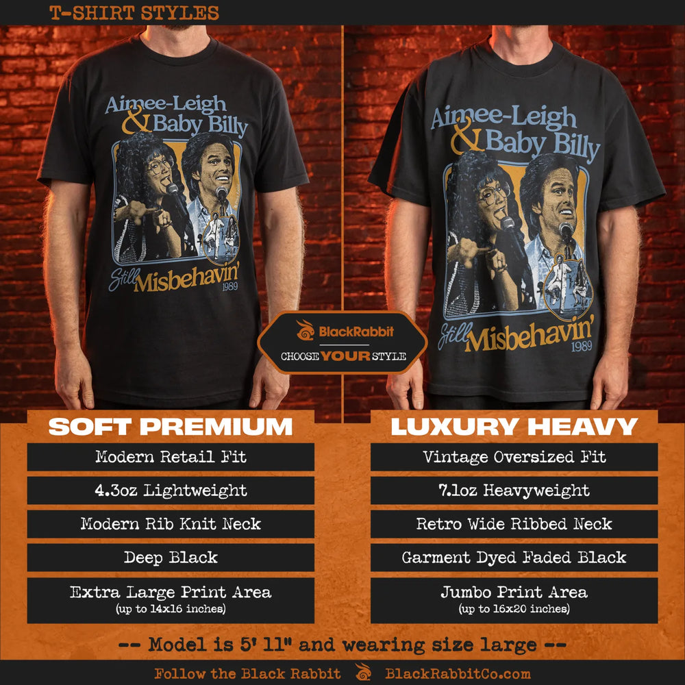 Two black t-shirts, one a slim fit and the other an oversized fit, both featuring an ’Aimee-Leigh & Baby Billy Still Misbehavin’ 1989’’ graphic.