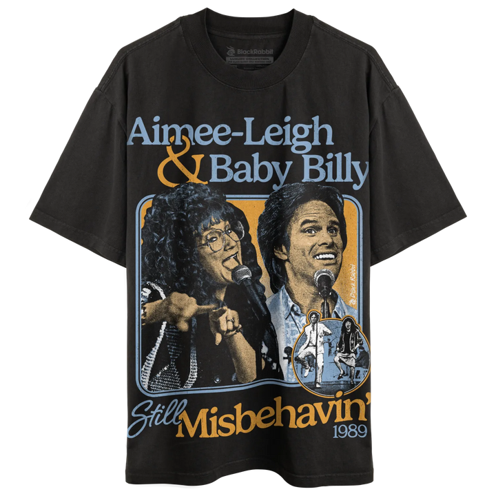 Black short-sleeved t-shirt with a graphic print featuring two people singing into microphones, ’Aimee-Leigh & Baby Billy,’ and ’Still Misbehavin’ 1989’’ text.