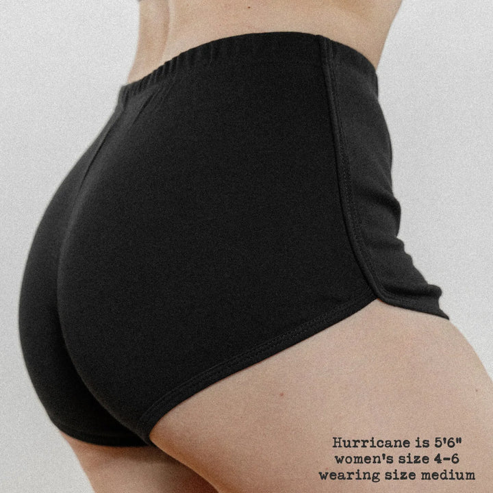 Rear-view of Female model wearing the Black variant of Black Rabbit&