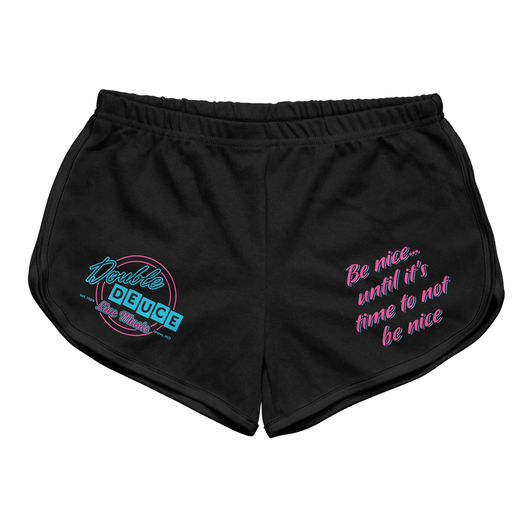Black athletic shorts featuring a neon blue and pink ’double deuce’ logo on the left leg and the phrase ’be nice...