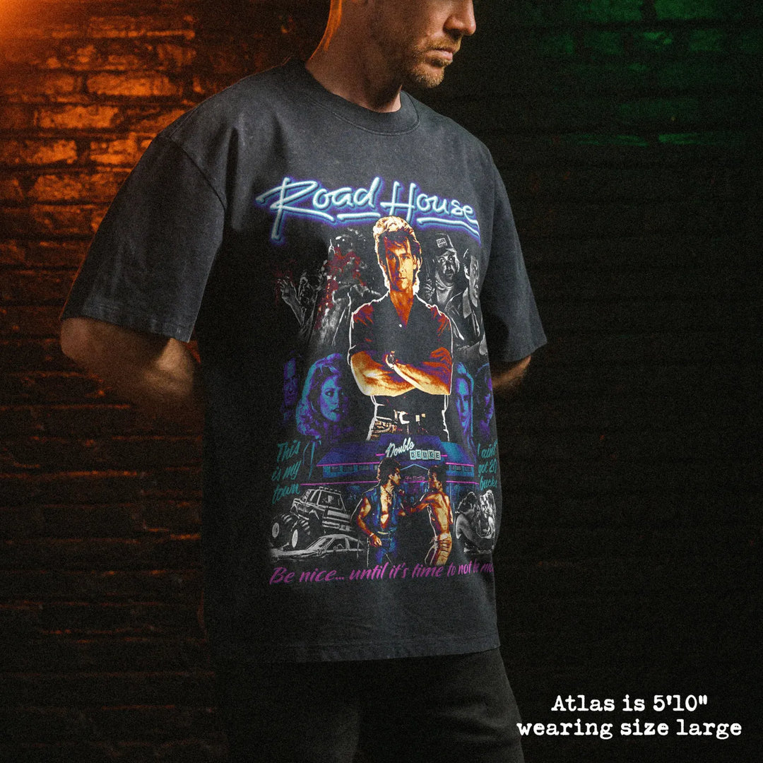 Male model wearing stone wash heavy tee with road house graphic 