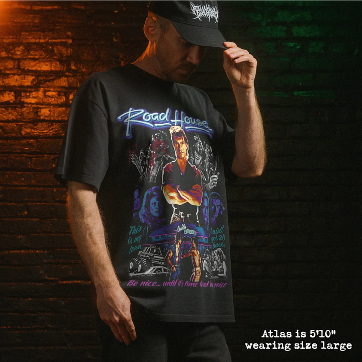 Model wearing heavy tee with road house graphic 
