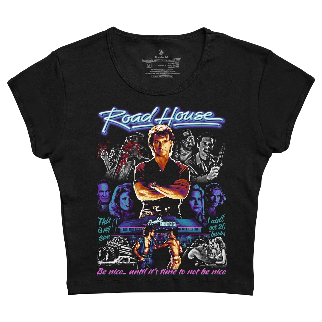 Black short-sleeved t-shirt featuring a vibrant, neon-style graphic of the movie ’road house’ with its iconic characters and quotes.