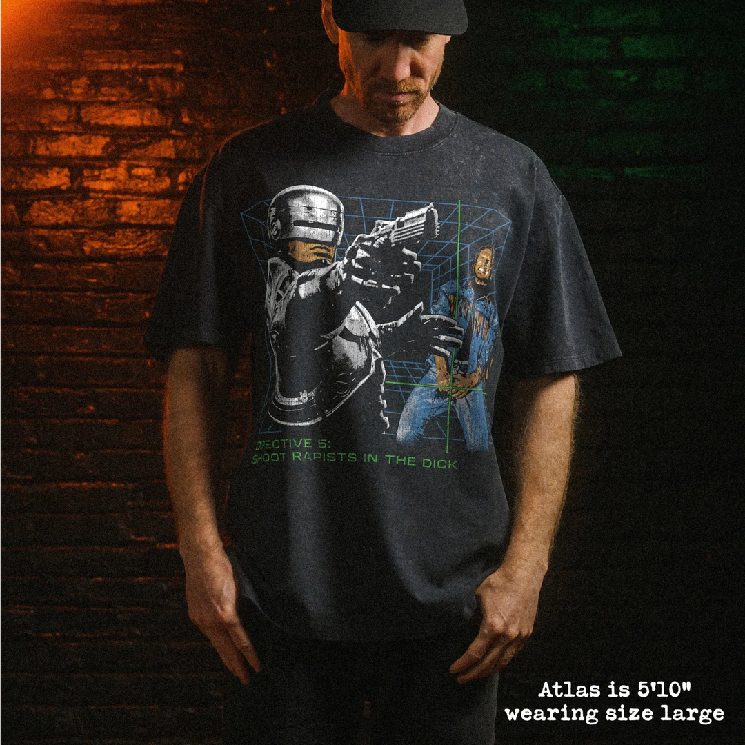 Male model wearing heavy stone washed tee with dick shot graphic. 