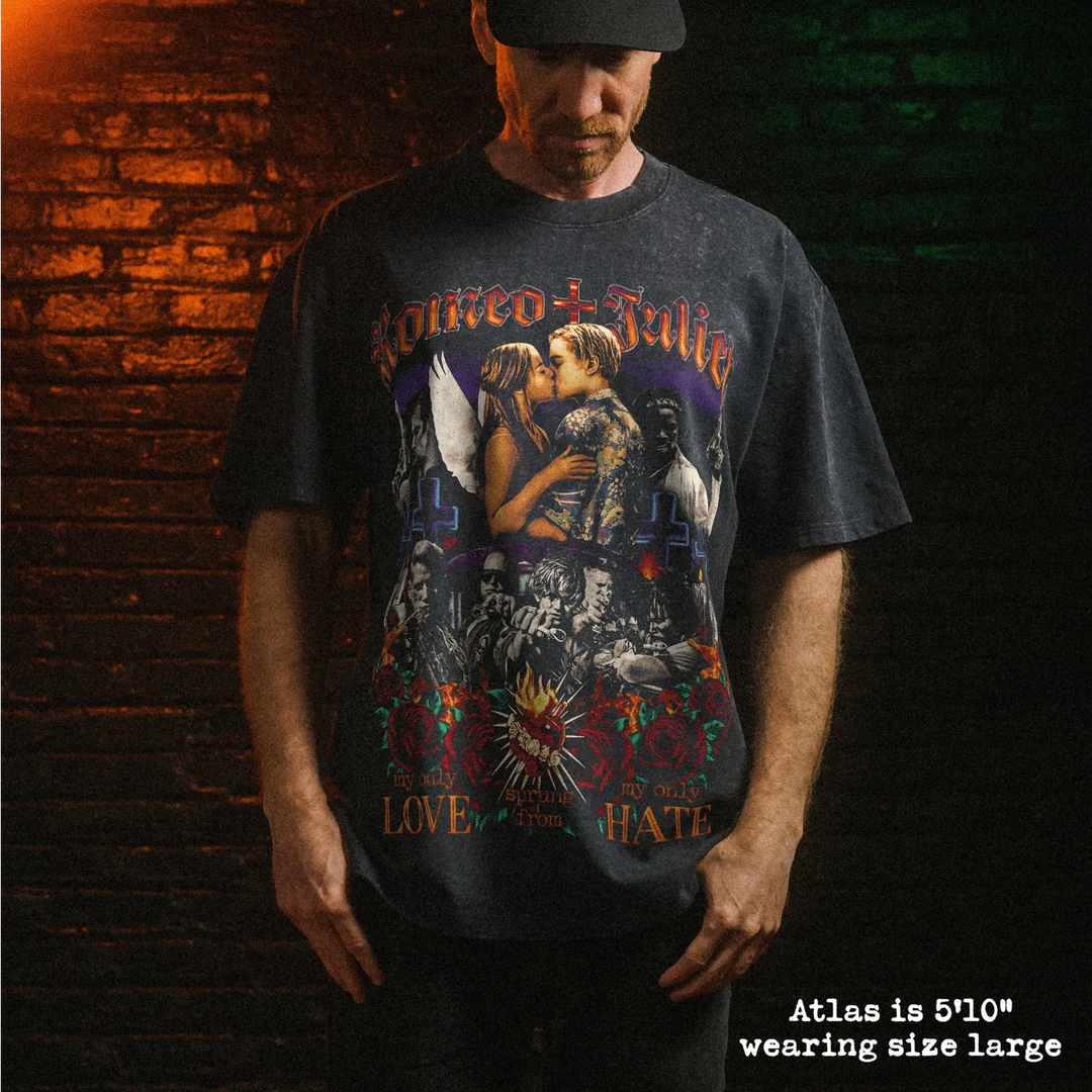Male model wearing heavy stone washed tee with romeo + juliet graphic. 