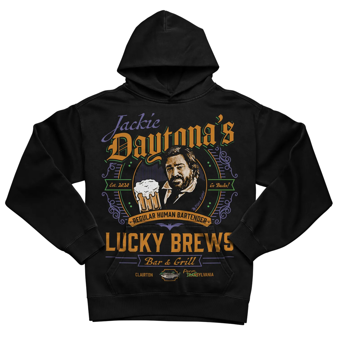 Black hoodie with ’jackie daytona’s lucky brews’ design featuring a smiling man and beer mug, made of cotton.