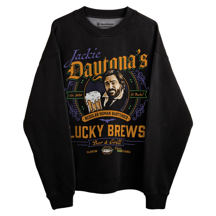Black crewneck sweatshirt with graphic design featuring a man holding beers, ’jackie daytona’s lucky brews’ text and logo.