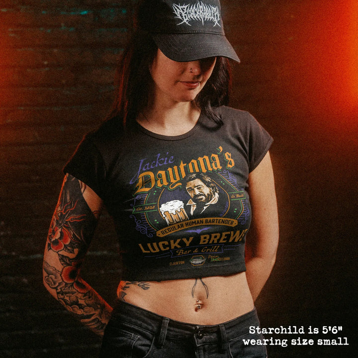 Female model wearing cropped baby tee with jackie daytona graphic

