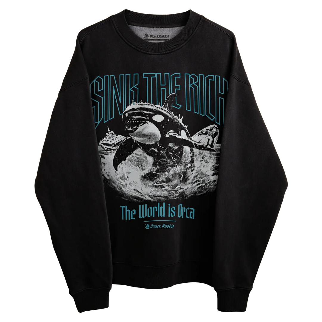 Black crewneck sweatshirt with orca whale graphic and text ’sink the rich’ in teal.