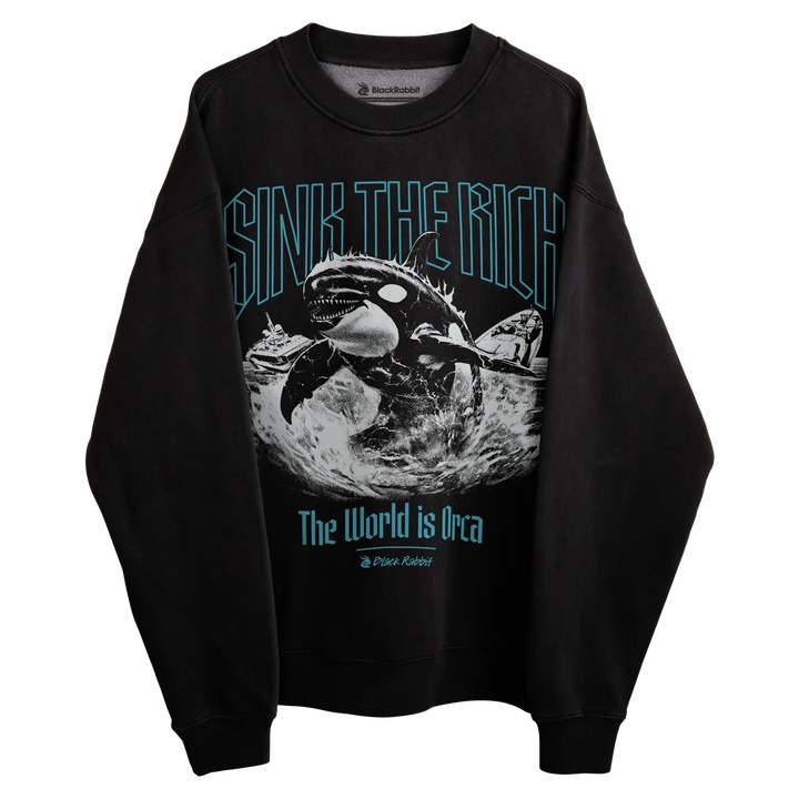 Black crewneck sweatshirt with orca whale graphic and text ’sink the rich’ in teal.