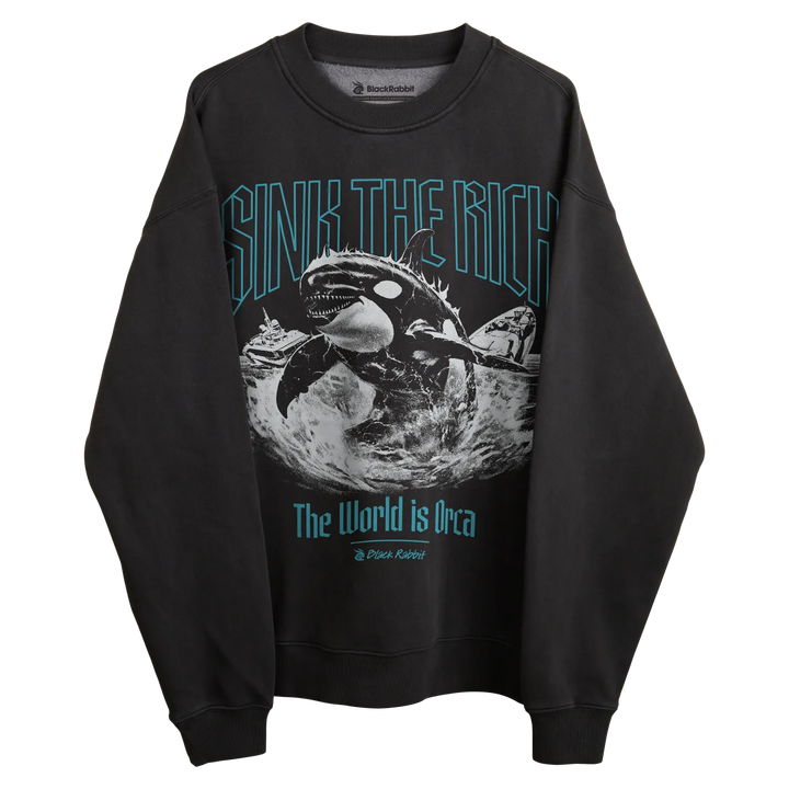 Black sweatshirt with orca whale graphic and text ’sink the rich’ in teal, featuring a crew neck.