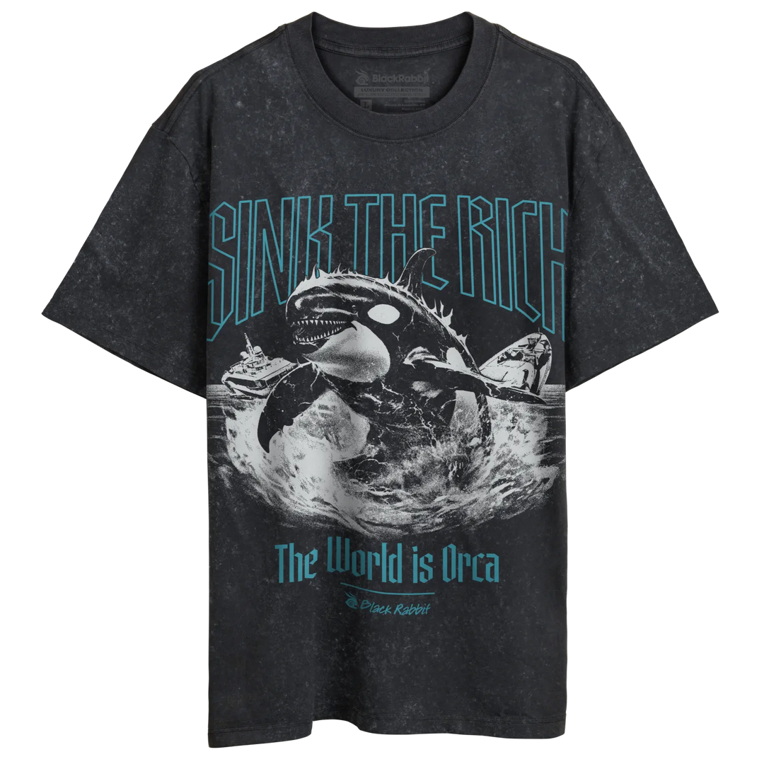 A dark gray, short-sleeved t-shirt with a blue and white graphic design featuring an orca, a ship, and the text ’SINK THE RICH’ and ’The World is Orca.’